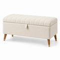 Taburete de almacenamiento en tela beige con patas de madera